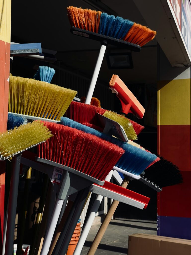 Professional cleaner vacuuming sofa cushions for deep upholstery cleaning