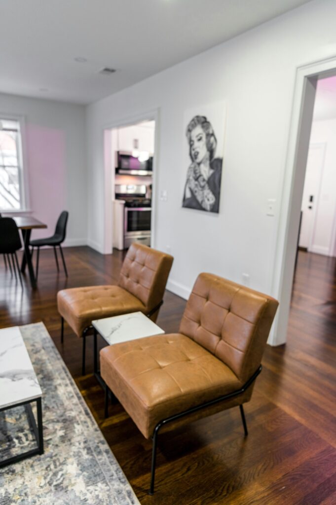Stylish apartment interior with leather seating and wall art