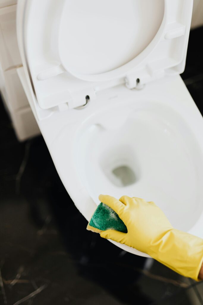 Professional cleaner organizing cleaning products and tools